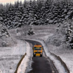 Snow falls on icy UK, causing treacherous conditions and travel warnings