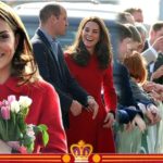 Kate Middleton giggles in royal red alongside Prince William on Belfast visit